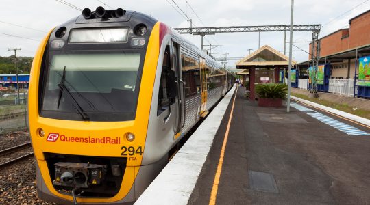 Queensland Rail train at station. | Newsreel