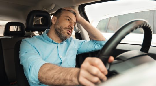 Frustrated motorist in traffic. | Newsreel