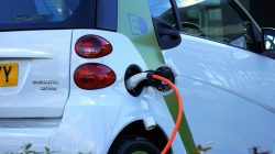 Electric car being charged. | Newsreel