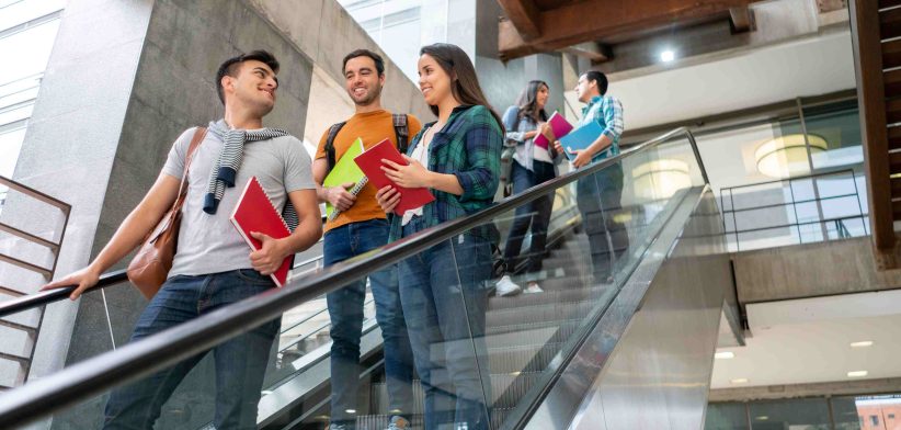 Students on escalator. | Newsreel