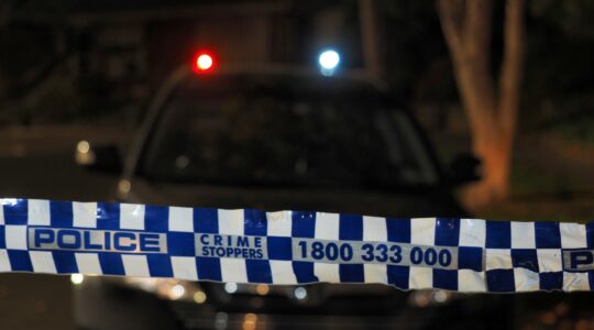 Police tape at crime scene with police car. | Newsreel