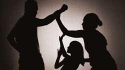 Silhouette of man abusing woman and child. | Newsreel