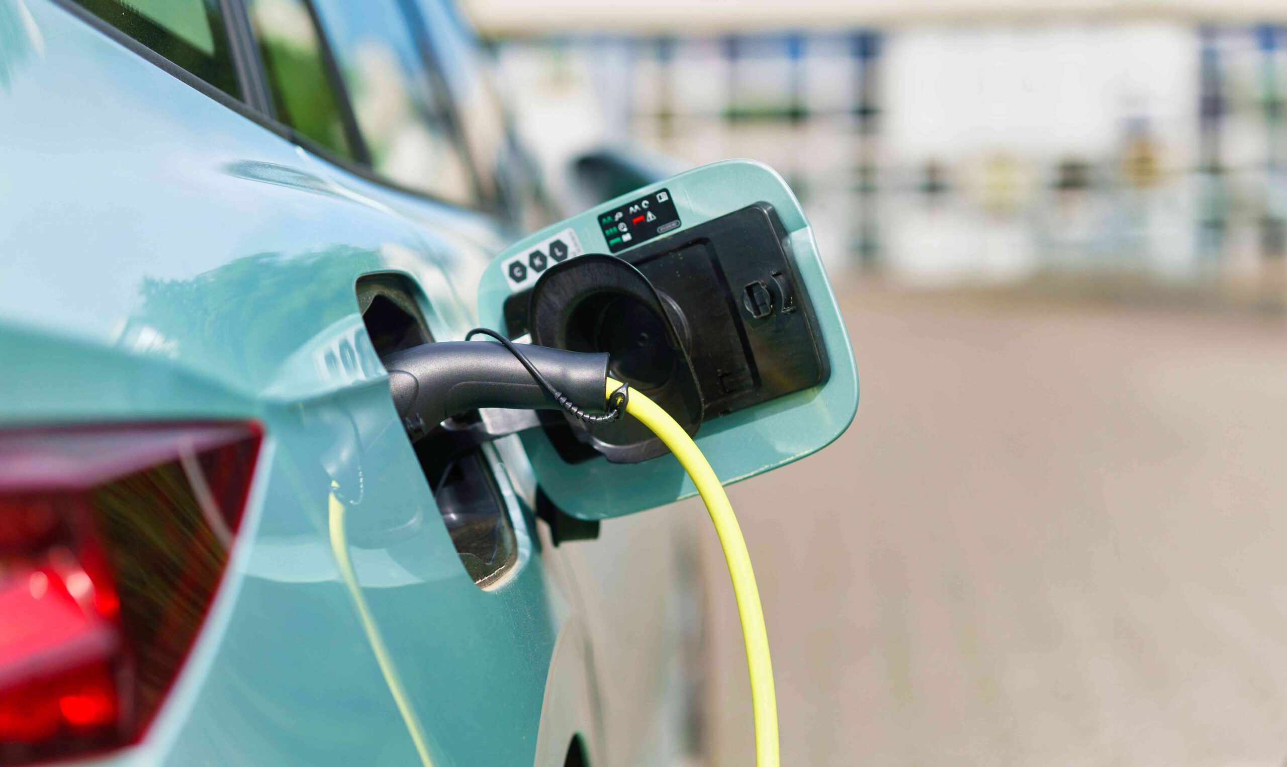 Electric car charging. | Newsreel