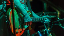 Musician playing electric guitar. | Newsreel