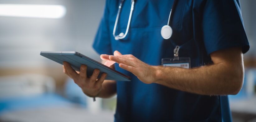 Health care worker looking at iPad | Newsreel