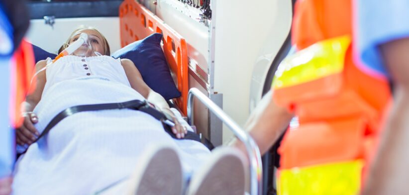 Injured child with paramedics. | Newsreel