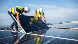 Workers installing solar panels. | Newsreel