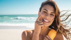 Woman applying sunscreen. | Newsreel