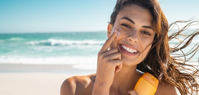 Woman applying sunscreen. | Newsreel