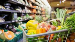 Supermarket trolley full of vegetables. | Newsreel