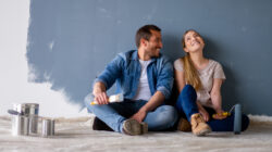 Couple rest after painting room. | Newsreel