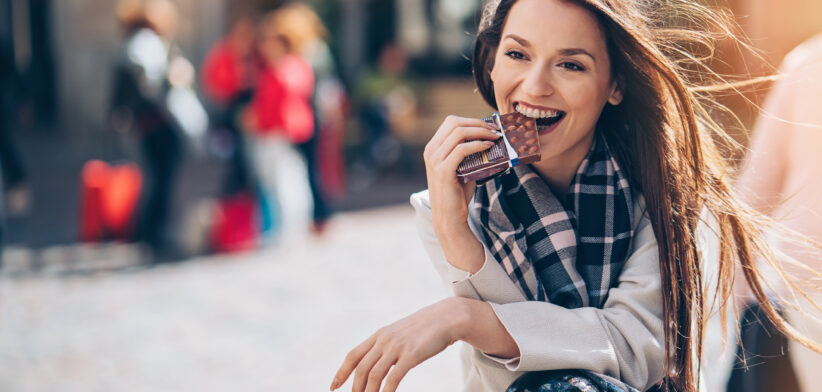 Woman eating chocolate. | Newsreel