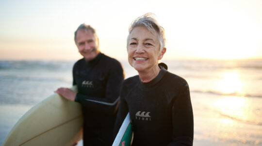 Mature age couple surfing. | Newsreel