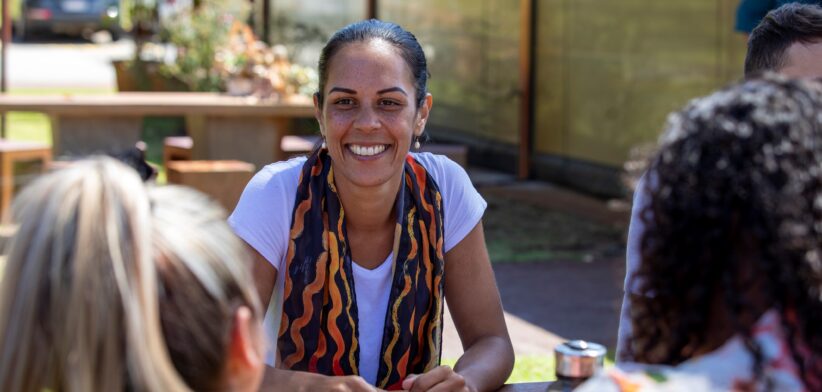 Young Aboriginal woman talking to group. | Newsreel