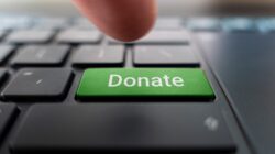 Donate button on computer. | Newsreel