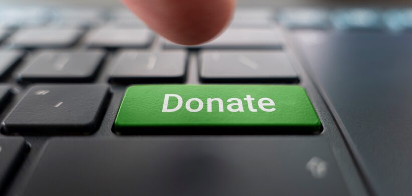 Donate button on computer. | Newsreel