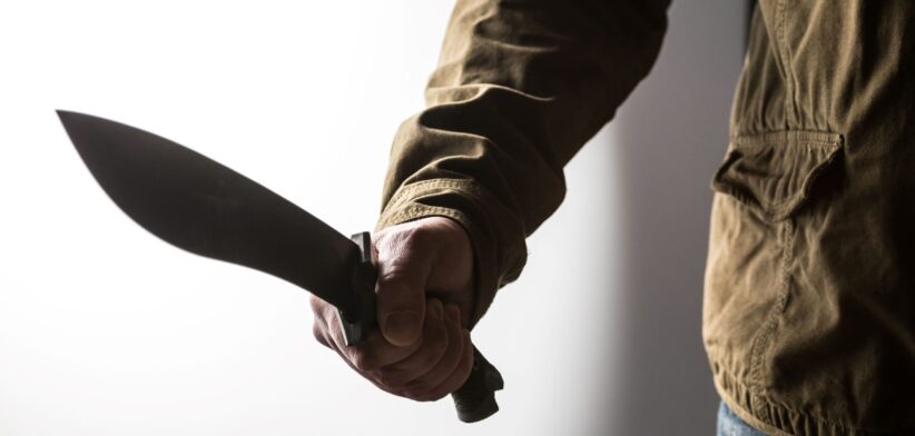 Man holding machete. | Newsreel