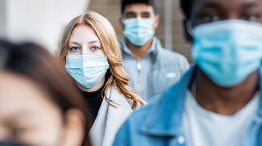 People wearing masks in crowd