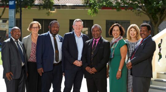 John Palma (First Secretary to the PNG Minister for Education), Mary Hurwood (program project manager, QUT Engagement and Development), Francis Alua (PNG MP for Karimui-Nomane), Professor Mark Harvey (QUT Deputy Vice-Chancellor, International and External Relations), Lucas Dawa Dekena (PNG Minister for Education), Professor Lori Lockyer (Executive Dean, QUT Faculty of Creative Industries, Education and Social Justice), Professor Sue Irvine (Head of the QUT School of Early Childhood and Inclusive Education), and Dr Uke Kombra (Secretary for the PNG Department of Education). | Newsreel