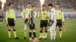 Officials at coin toss of football match Newcastle v Tottenham in Australia.