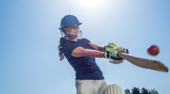 Woman batter playing cricket. | Newsreel