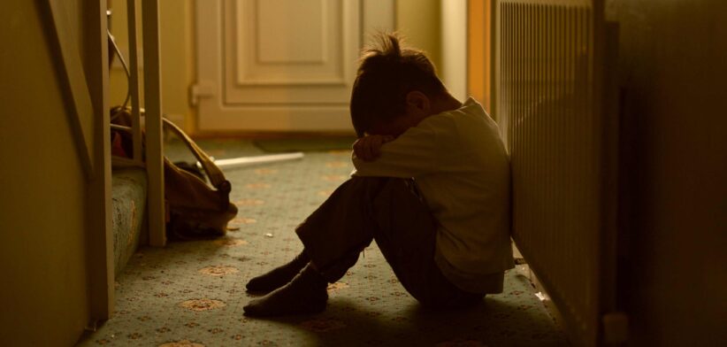 Sad child in hallway.| Newsreel