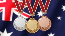 Gold silver and bronze medals with Australian flag. | Newsreel