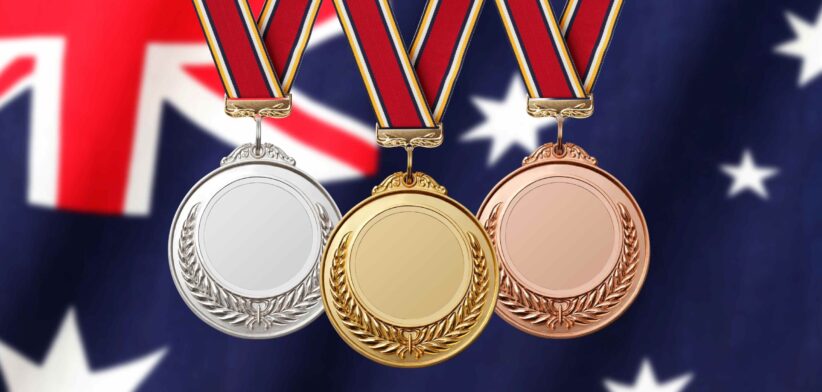 Gold silver and bronze medals with Australian flag. | Newsreel