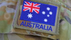 Australian flag on army uniform sleeve. | Newsreel