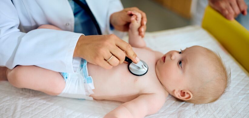 Baby undergoing health check. | Newsreel
