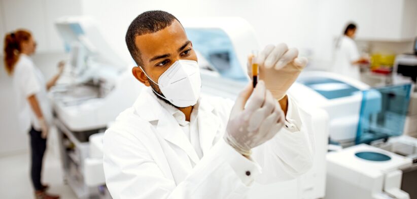 Man in lab testing blood. | Newsreel