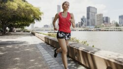 Woman jogging beside Brisbane river at Southbank. | Newsreel