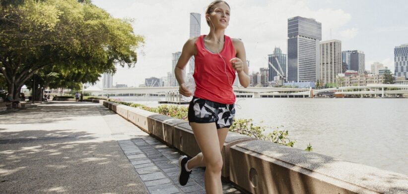 Woman jogging beside Brisbane river at Southbank. | Newsreel