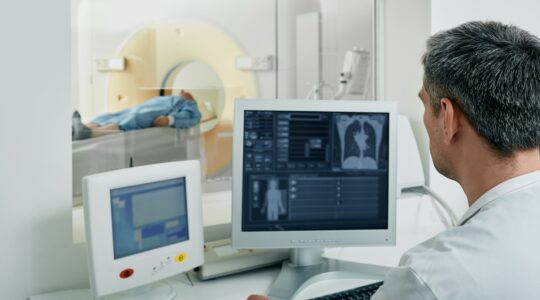 Radiologist performing a CT scan. | Newsreel