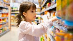 Child shopping in supermarket. | Newsreel