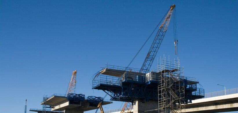 Cranes building a bridge. | Newsreel