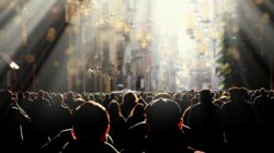 Crowd walking towards light. | Newsreel