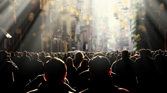 Crowd walking towards light. | Newsreel