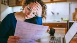 Woman worried about bills. | Newsreel
