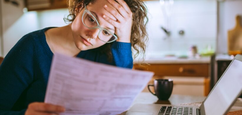 Woman worried about bills. | Newsreel