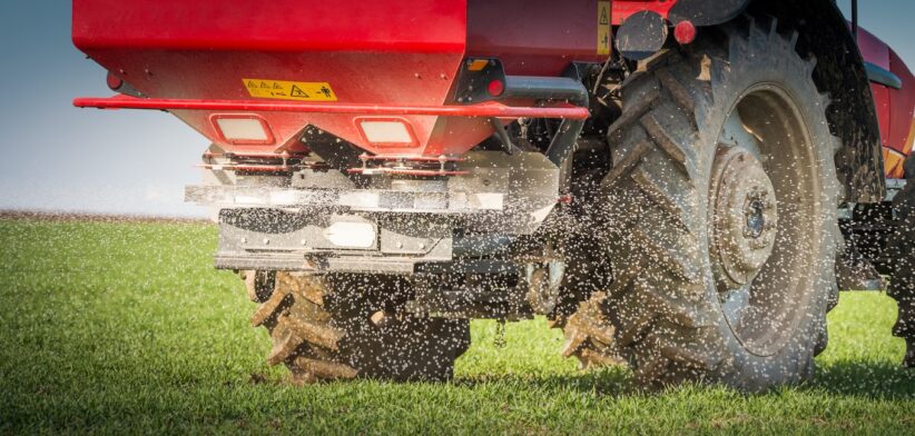 Tractor spreading fertiliser. | Newsreel