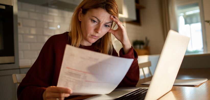 Woman worried about a bill. | Newsreel