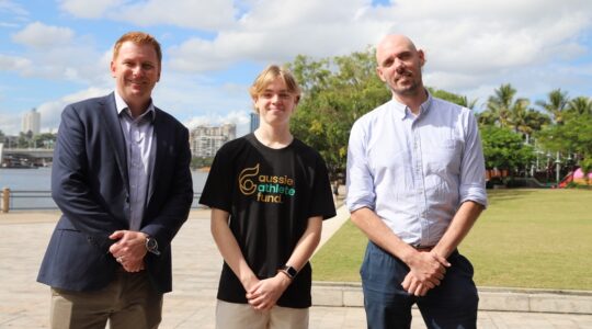 Trampolinist Hudson Brown with PeopleIN CEO Ross Thompson, left, and Marketing and Communications Head Craig Thomas, right. | Newsreel