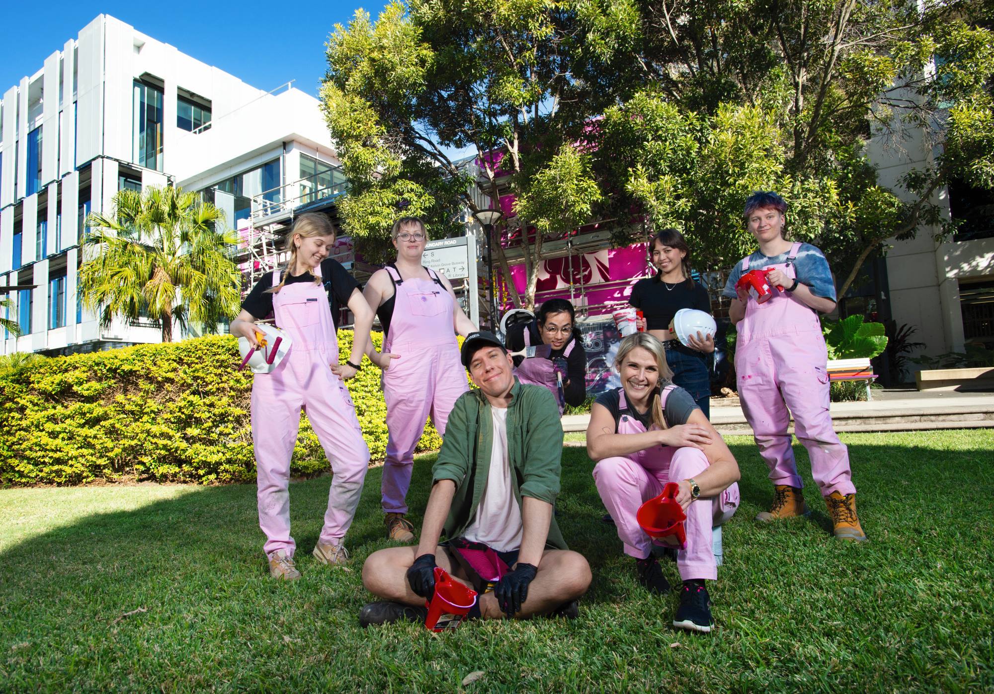 QUT artists Milan MacMahon, Caroline Girdler, Michael Bethurem, seated, James Hua, Frances Hitzke, seated, Cara Orendain and Arlo Terry. Newsreel