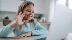 Young children on laptop talking to someone. | Newsreel