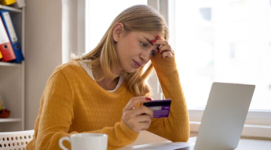 Woman worried about credit card. | Newsreel