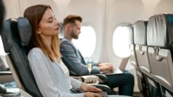 Woman sleeping on a plane. | Newsreel