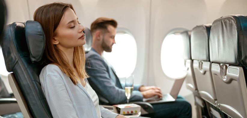 Woman sleeping on a plane. | Newsreel