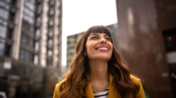 Happy woman in city. | Newsreel