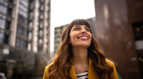 Happy woman in city. | Newsreel